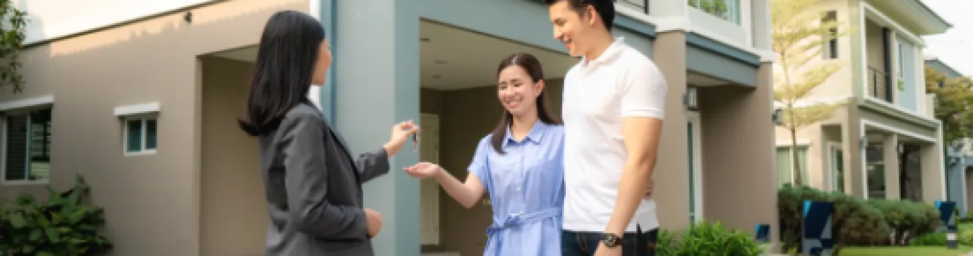 Wa We Property Management handing keys to a happy couple at a Property For Lease in Stamford, highlighting trusted rental property services